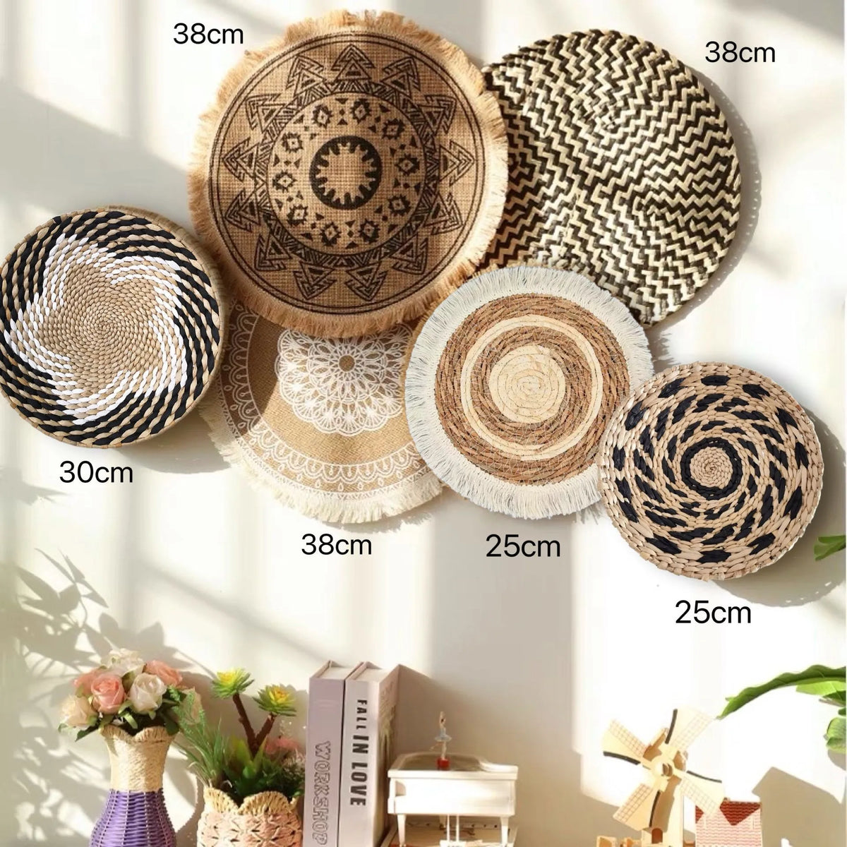 A collection of round boho straw wall hangings with varying sizes and textures displayed against a light background.