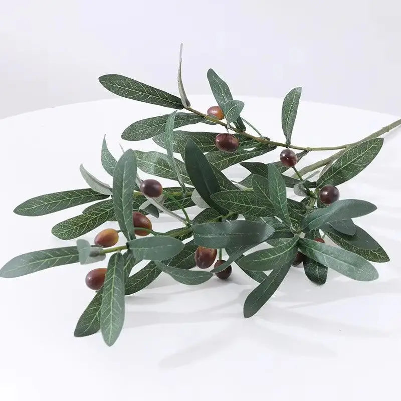 Artificial olive branch with dark green leaves and small reddish-brown fruits for home decor
