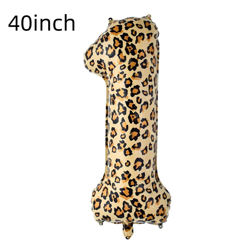 A large, yellow leopard print number balloon shaped like the letter 'I' for a birthday party.