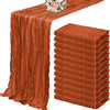 A set of ten terracotta semi-sheer cheesecloth table runners displayed on a table.