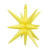 A cluster of yellow star burst foil balloons used for party decor.