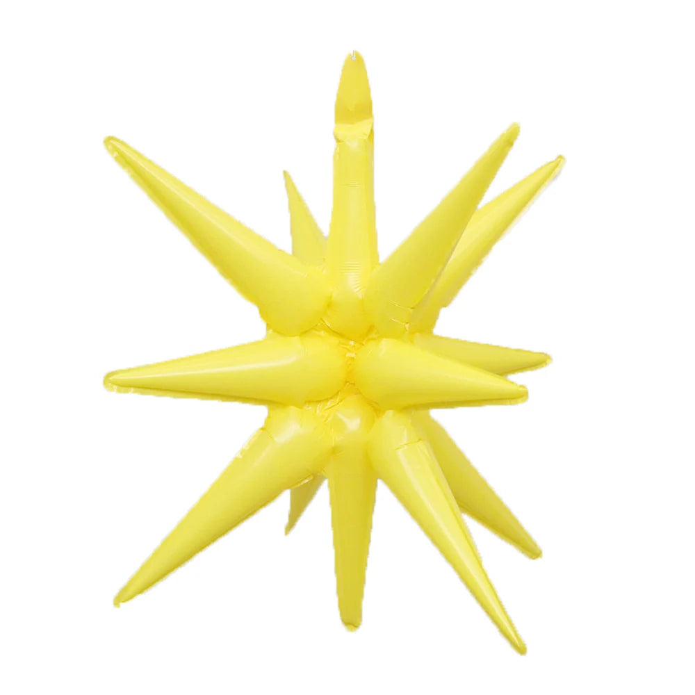 A cluster of yellow star burst foil balloons used for party decor.