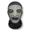 A grayscale mask resembling a distorted face with glowing yellow eyes, used as funny carnival headgear for cosplay.