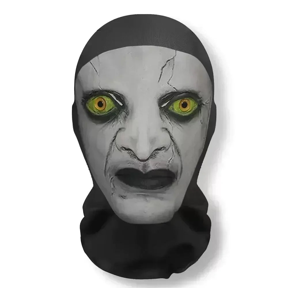 A grayscale mask resembling a distorted face with glowing yellow eyes, used as funny carnival headgear for cosplay.