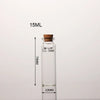 A clear glass bottle with a cork stopper, labeled 15ML and measuring 70MM in height.