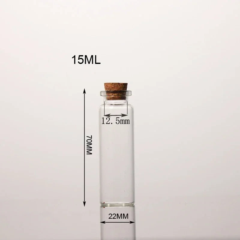 A clear glass bottle with a cork stopper, labeled 15ML and measuring 70MM in height.