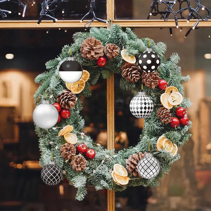 A festive wreath decorated with pine branches, pinecones, red berries, and various ornaments including polka dots and citrus 
