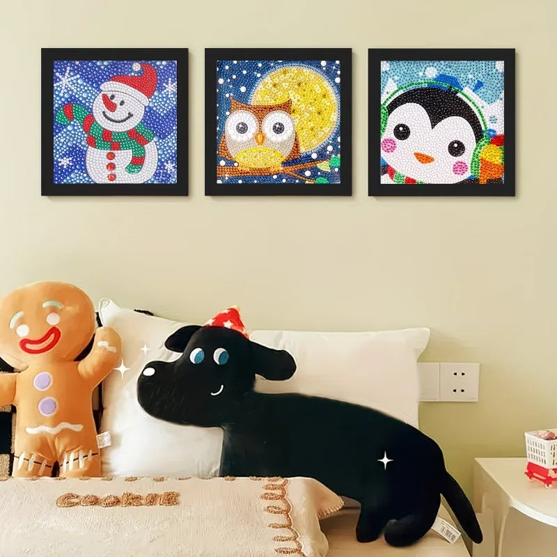 Three framed diamond painting artworks featuring a snowman, an owl, and a panda face.
