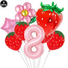 A set of nine pink and red balloons, including a strawberry shape and the number eight, for a party kit.