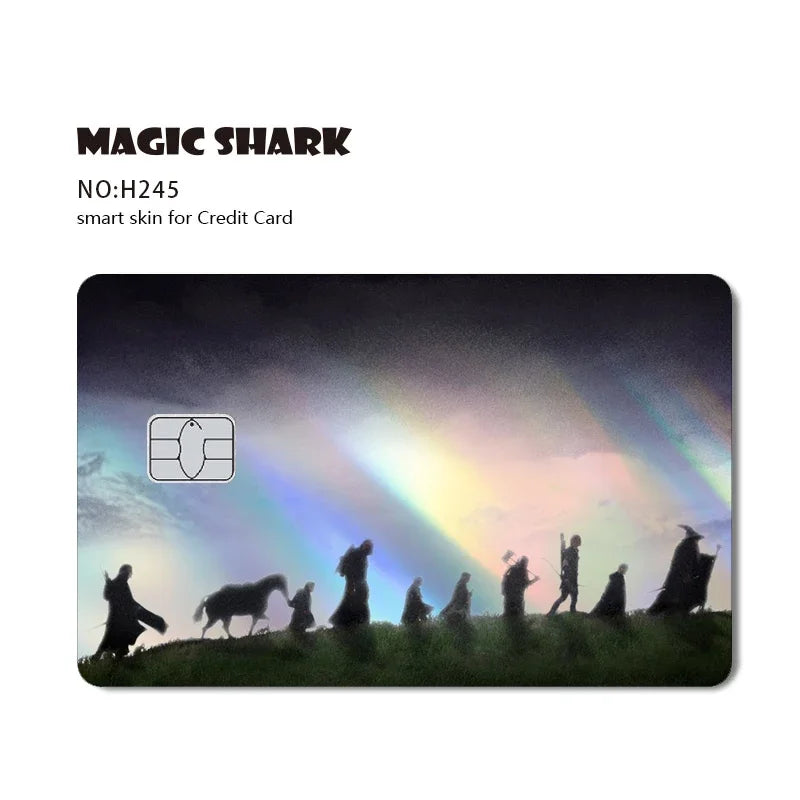 A dark landscape featuring silhouettes of animals and people under a rainbow, used as a design for a Magic Shark credit card 