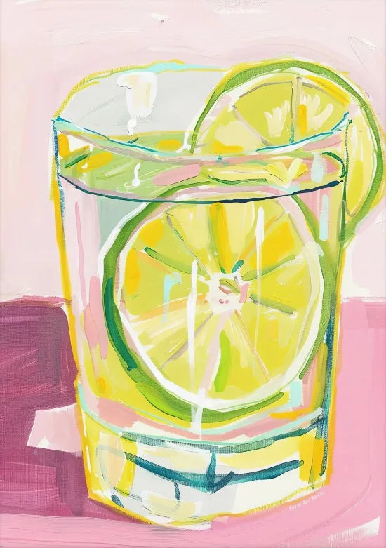 A glass filled with yellow lemon slices and green liquid on a pink background.