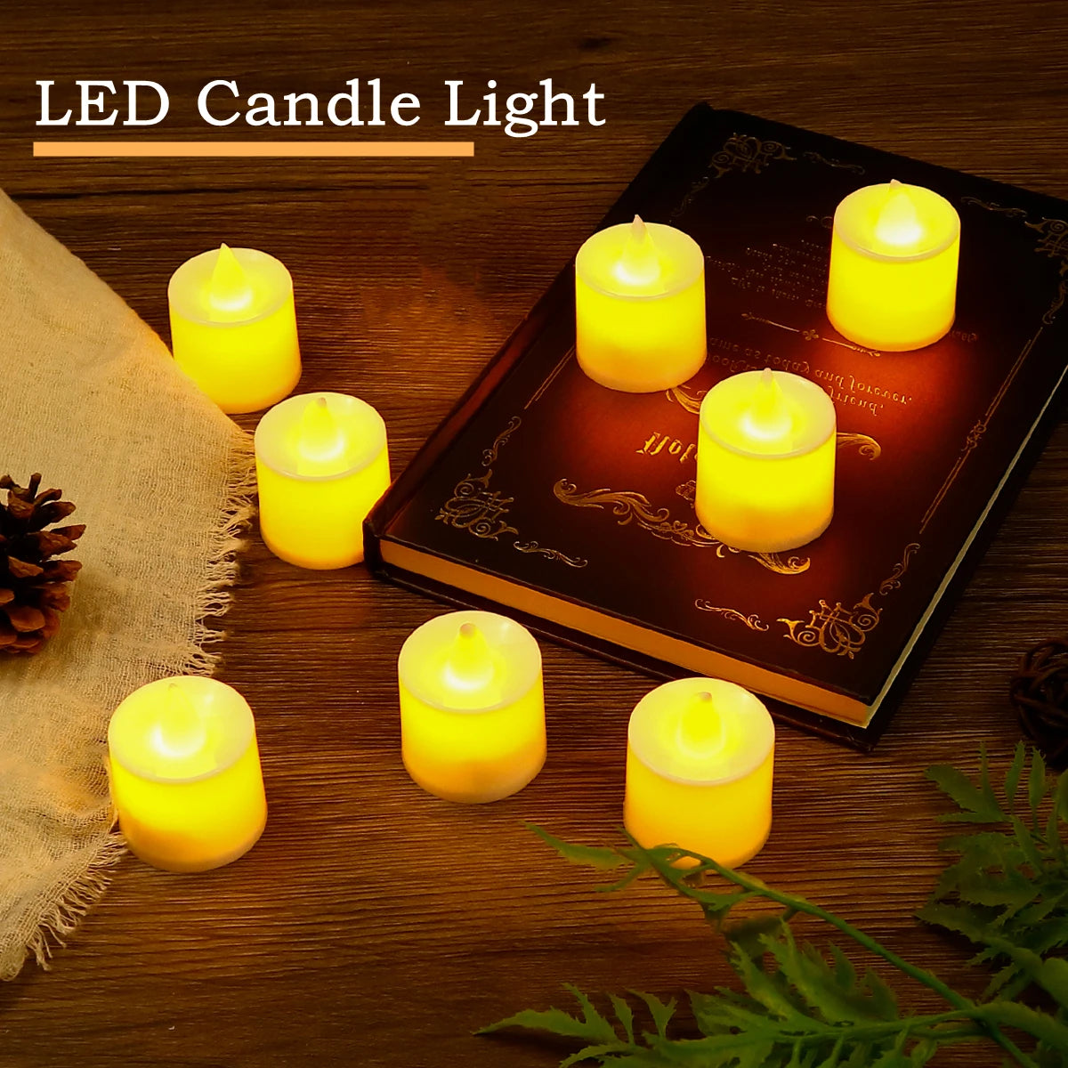 A set of glowing yellow LED candle lights placed on a wooden surface next to pine cones and green foliage.