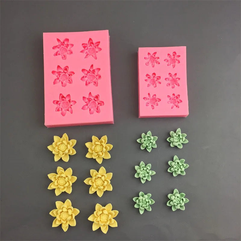 A collection of pink and yellow lotus leaf fondant silicone molds for cake decorating.