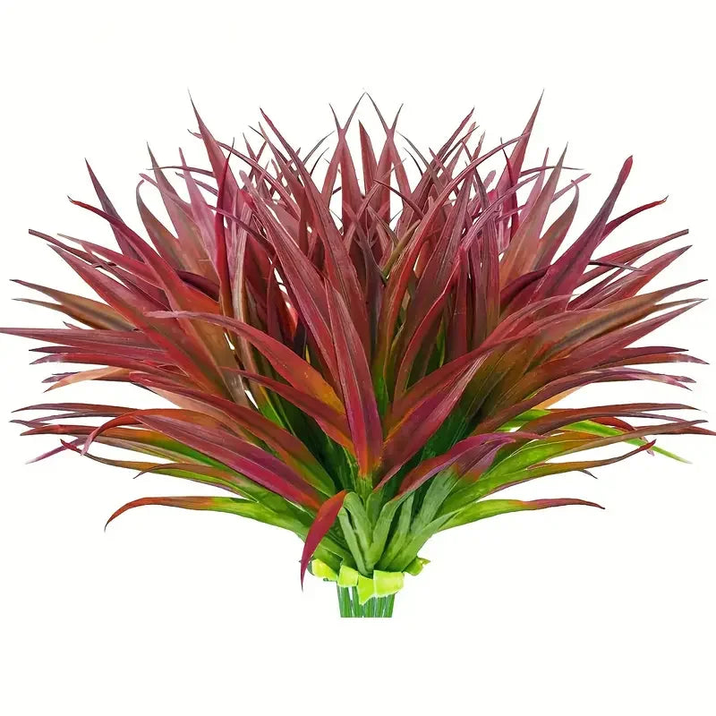 A bouquet of deep red and burgundy artificial tall grass and tropical flowers for indoor or outdoor decor.