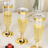Three elegant gold-rimmed champagne flutes filled with pale yellow liquid on a white surface.