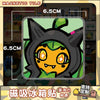 A close-up of a black and green stylized character design for a magnetic tile product.