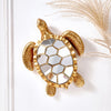 Golden sea turtle resin wall decor mirror with a textured gold frame and shell design