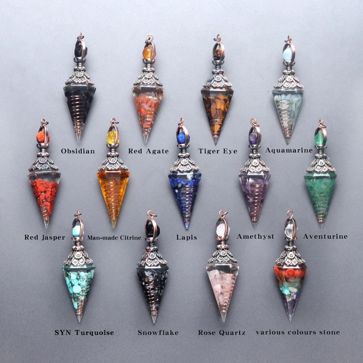 A collection of natural crystal pendants including Obsidian, Red Agate, Tiger Eye, Aquamarine, and various colored stones.