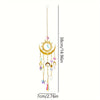 A hanging crystal wind chime featuring a sun, moon, and various dangling charms.