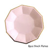 Eight 9-inch pink disposable plates with gold trim