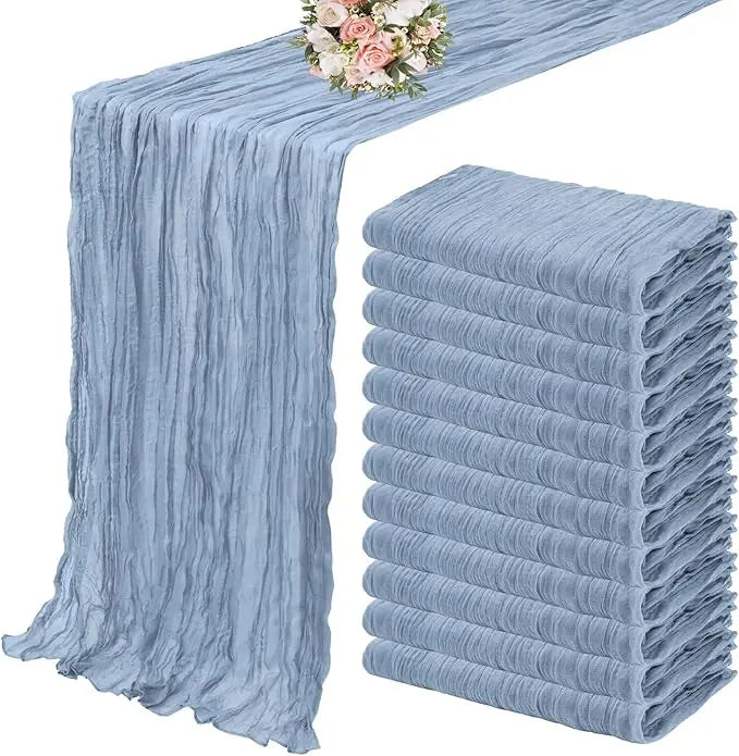 A set of ten terracotta semi-sheer cheesecloth table runners in a dusty blue color.