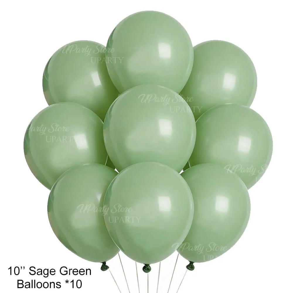 Ten sage green balloons arranged in a cluster for a birthday celebration