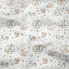 Light patterned fabric featuring a repeating floral print of various woodland animals like rabbits and bears.