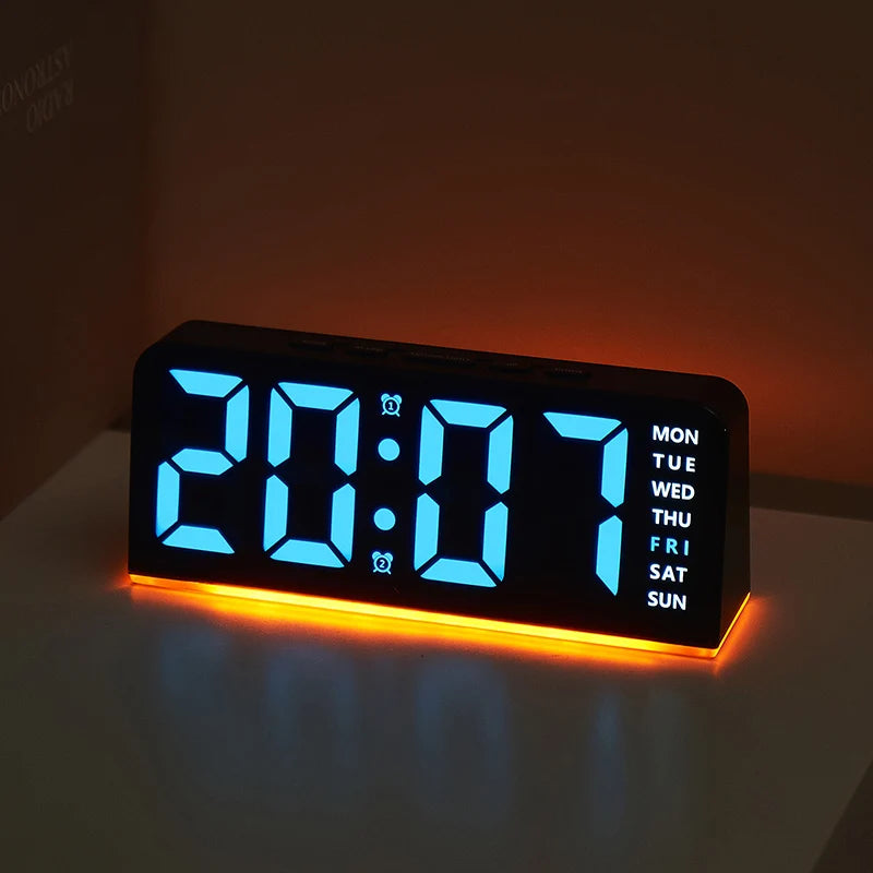 A black digital alarm clock displaying 20:07 with an orange glow on a white surface.