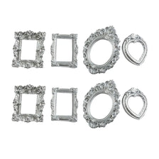 A set of six vintage resin shadow box frames in silver finish for DIY memory displays.