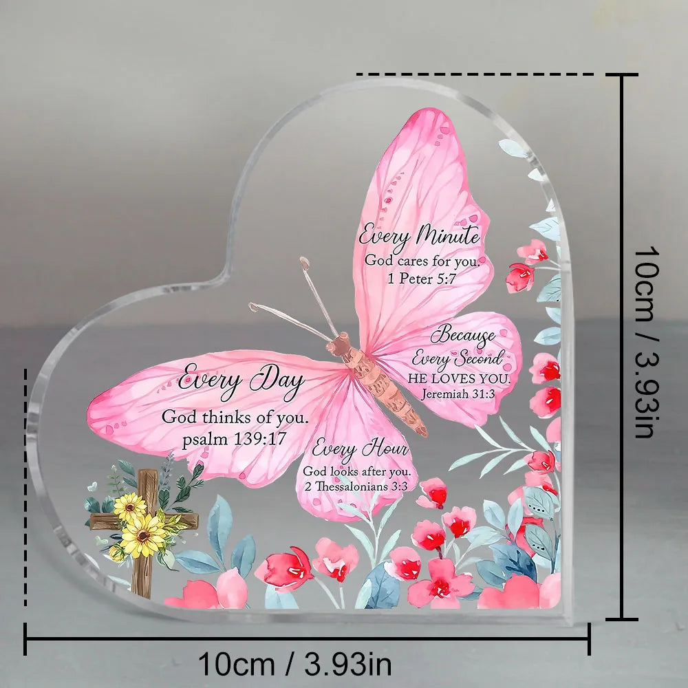 Pink watercolor butterfly design on a clear heart-shaped acrylic desk decor featuring Bible verses