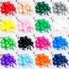A collection of colorful latex balloons in various shades including red, yellow, pink, green, white, black, purple, and orang