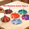 One piece random color size L 3D-printed star fidget spinner with handle resting on a wooden table.
