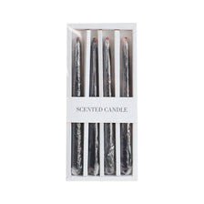 A set of four black taper candles with a dripping blood effect inside a white box.