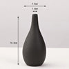 A matte black ceramic vase with a tapered neck and rounded body, shown against a white background.