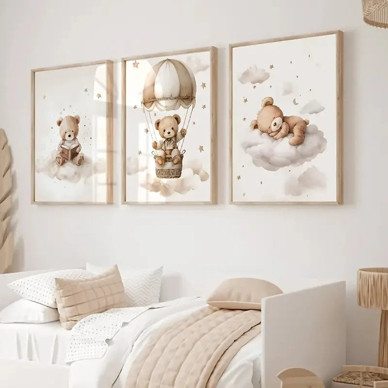 A set of three framed canvas art prints featuring teddy bears in clouds and an aerial theme for a nursery
