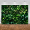 A lush green tropical palm leaf backdrop used for party decor and photography.