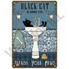 Vintage metal sign featuring a black cat drinking from a sink and the text Wash Your Paws