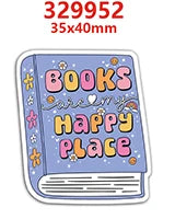 A sticker featuring the text BOOKS ARE HAPPY PLACE on a purple book design.