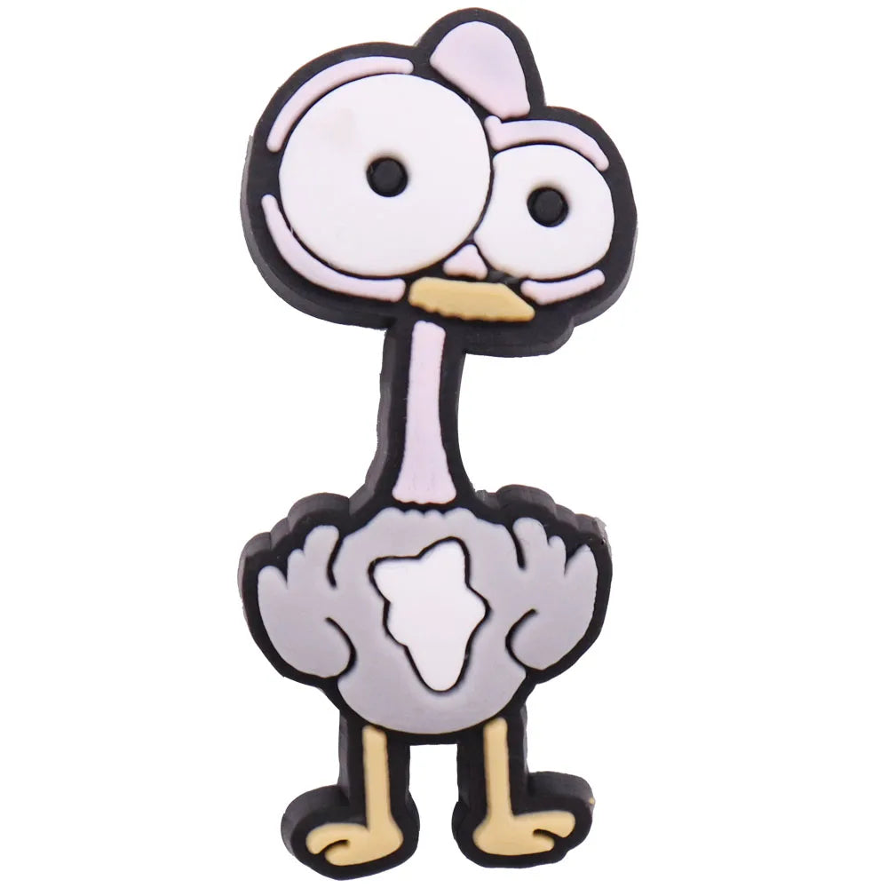 A set of twelve cartoon dinosaur PVC shoe charms featuring a stylized dinosaur head and body.