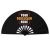 A black folding hand fan with the text YOUR DESIGN HERE displayed in orange and red.