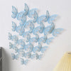 A set of light blue 3D hollow butterfly wall decals arranged in a decorative pattern.