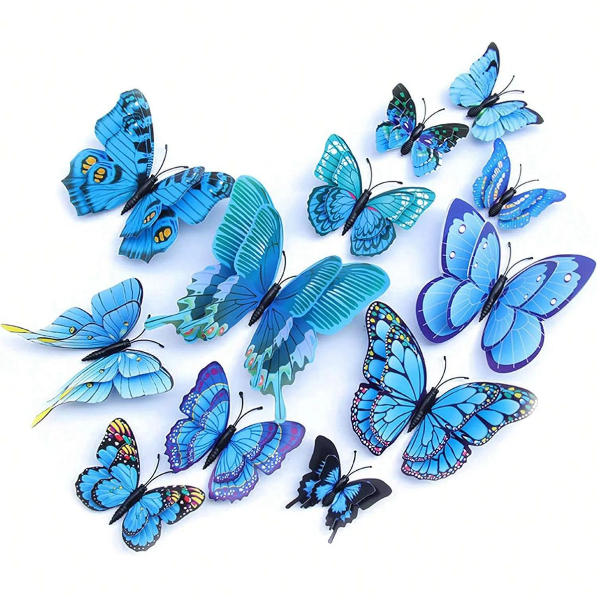 A set of twelve blue and black magnetic butterfly wall decor pieces.