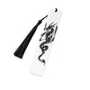 A white bookmark with a black dragon design and a black tassel.