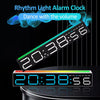 A digital alarm clock displaying 20:38:56 on a black background with a light bar design.