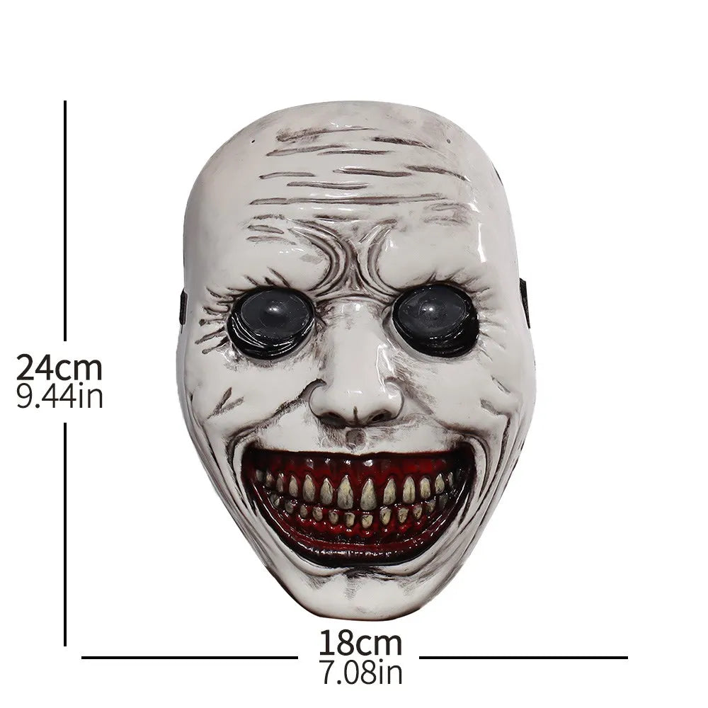 A white demon mask with a wide, menacing grin and dark eyes, used for Halloween cosplay.