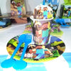 A set of Minecraft-themed party supplies including a flag pulling cake topper and tableware on a white surface.