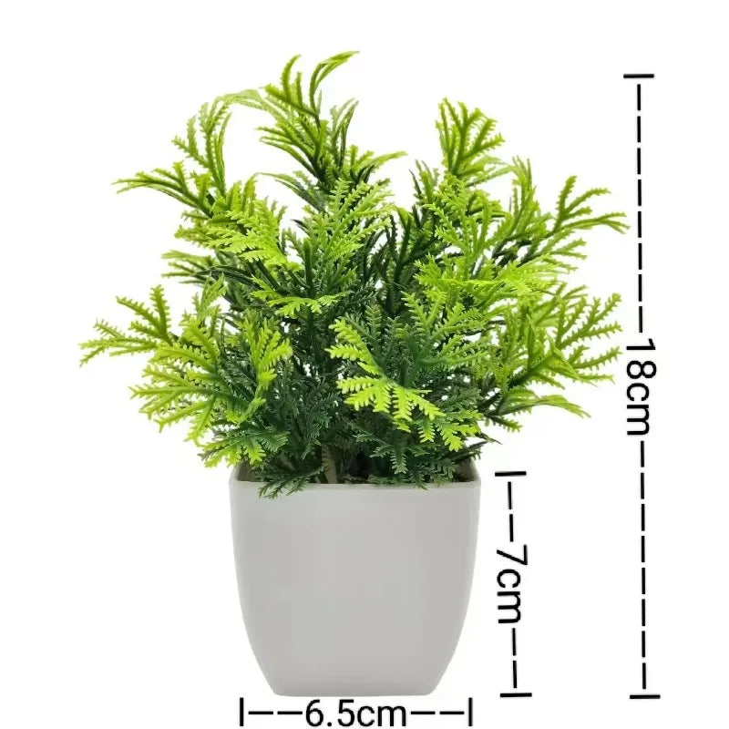 Künstliche Bonsai-Pflanze in weißem Topf mit grünem Laub und Höhenangaben