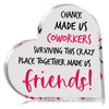 A heart-shaped plaque with pink text that reads Chance made us coworkers surviving this crazy place together made us friends