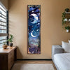 A vertical tapestry wall hanging featuring a celestial scene with a crescent moon and stars in deep blue and purple tones.