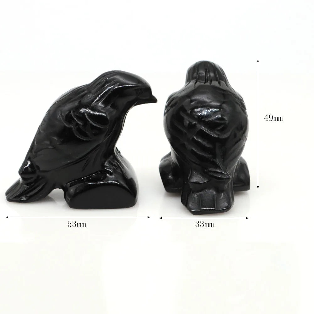 Hand-carved black obsidian raven figurine shown from the side and back with dimensions.